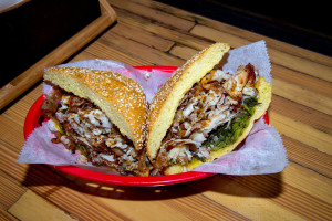 Porchetta sandwich at Mekelburg’s Is it the way the hard snap of the pig skin echoes the loud crunch of the roll paved with sesame seeds? The benign bitterness of the broccoli rabe under the pork? The garlic and herbs that blend into everything else and at the same time don’t? Not sure, but I’ll keep going back until I know.